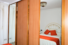 Bedroom with wall wardrobe